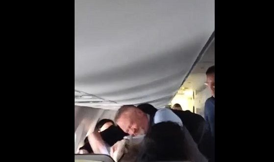 Flight Attendant on Alaskan Airlines Throat Punches Psychotic Passenger Who Won’t Let Go of Womans Hair.